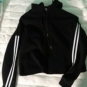 Cropped black hoodie with 2 white stripes on arm.